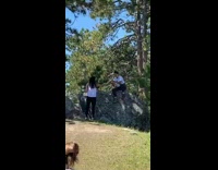 Girl poses with mount rushmore in background 