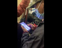 [third party - video] Man in train watch dancing girl video