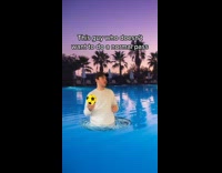 Guy skit throwing yellow volleyball water park