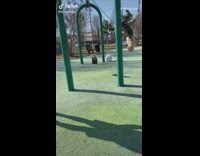 Grandpa swinging on swing does backflip park