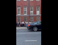 People lining up outside Halloween costume store 