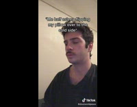 Guy flips dark blue pillow sleeping