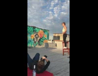 Guy white top jump shot chair mural