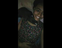 Small black puppy dog on neck girl 