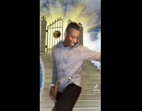 Guy shows God his shoes play music