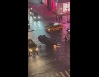 Car is upside down in an intersection 