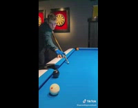 Guy does billiards trick shot spinning cue ball 