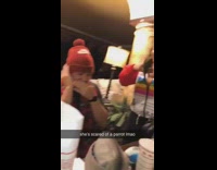 Guy covers ears mouth green parrot bird 