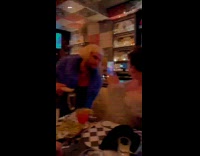 man purple fur jacket bob wig bar