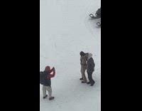 Couple poses for photo by stranger in blizzard