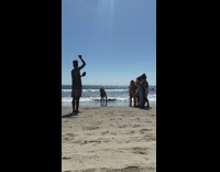Group woman bikini walk slap man beach