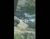 Couple Takes Selfie in Middle of Street 