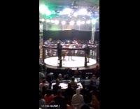 [mma event] Filmer watch and cheer at MMA fight