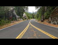 Green shirt lady rides electric bicycle road
