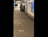 Rat comes out of subway station wall 