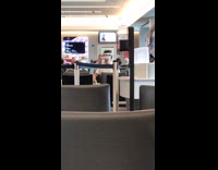 Collab WINY - Man playing VR goggles at airport