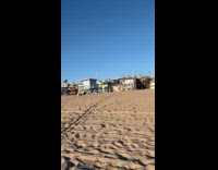Woman shiny outfit beach photoshoot with kids