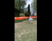Woman ballet outfit dances at tulip festival