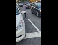 Guy blows whistle directs traffic road street