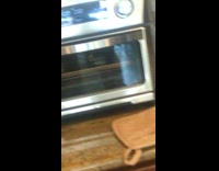 Pizza slice spin around fast inside oven