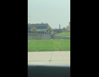 Guy striped black shirt slant metal railings