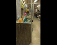 Woman pink shirt film music video at subway