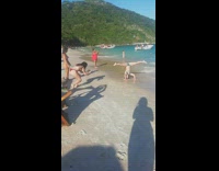 Girl does yoga pose on beach 