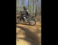 Black skeleton jacket guy green dirt bike 