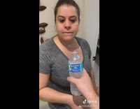 Guy squeezes water bottle splashes girl prank 