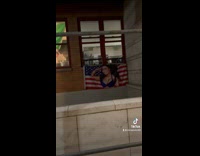 Girl in black pledging allegiance to Nicki Minaj american flag 