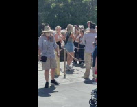 Three girls tiktok with dinosaur behind them