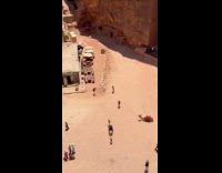 Woman video shoot at the desert ruins