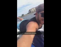Guy rides blue jet ski on stomach 