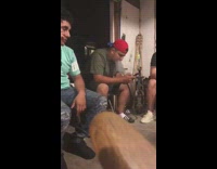 Guy smokes hookah in garage with friends and gets a lucky shot