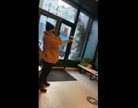 Woman brown coat hold drink store plants