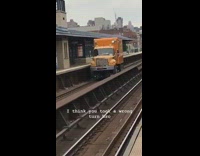 yellow truck in train tracks