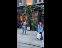 Bush man scares people walking on street