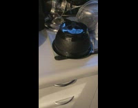 Reflection of light from the blinds on the container