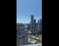person on roof planes over nyc buildings