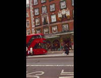 Couple in white outfit holds an infant bodysuit