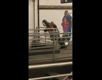 Guy wearing mask does push ups railing