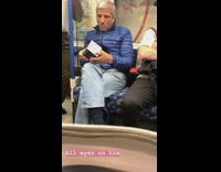 Man puffy blue jacket finishes 9x9 rubiks cube subway