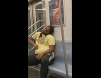 Guy sleeps on the subway train with head neck bent 