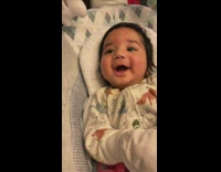 Baby laughs with filmer