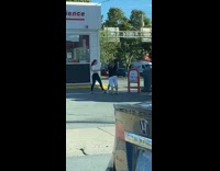 Two girls lean back wave arms store 