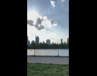 White drawstring backpack girl dances while walking 