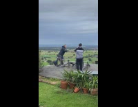 Guy drink coffee on very windy hill