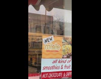 Pigeon tries to sit on taped sign 