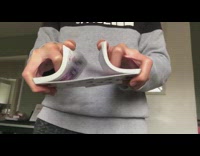 Guy shuffles playing cards in slow motion