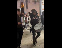 Submitter films musical band parade on street